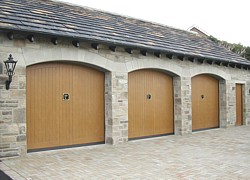 DOC non protruding garage doors  in arched openings